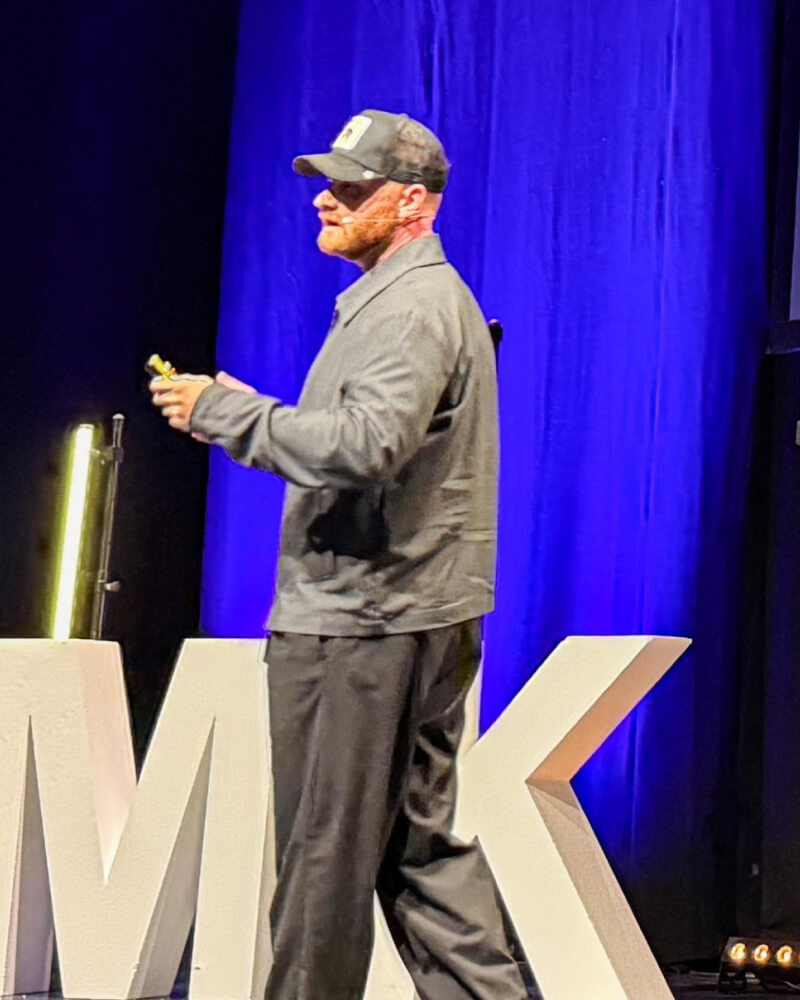 Nordic Scott speaking at a live event